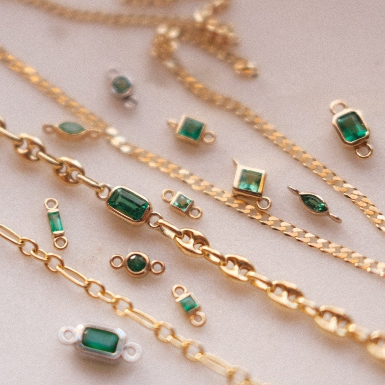 Natural emerald gemstones and solid gold chains
