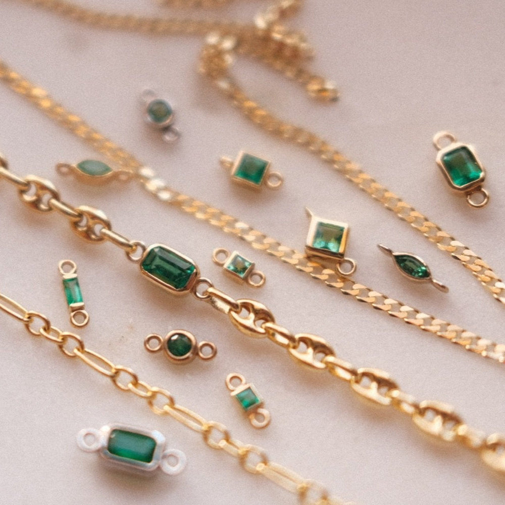 Natural emerald gemstones and solid gold chains