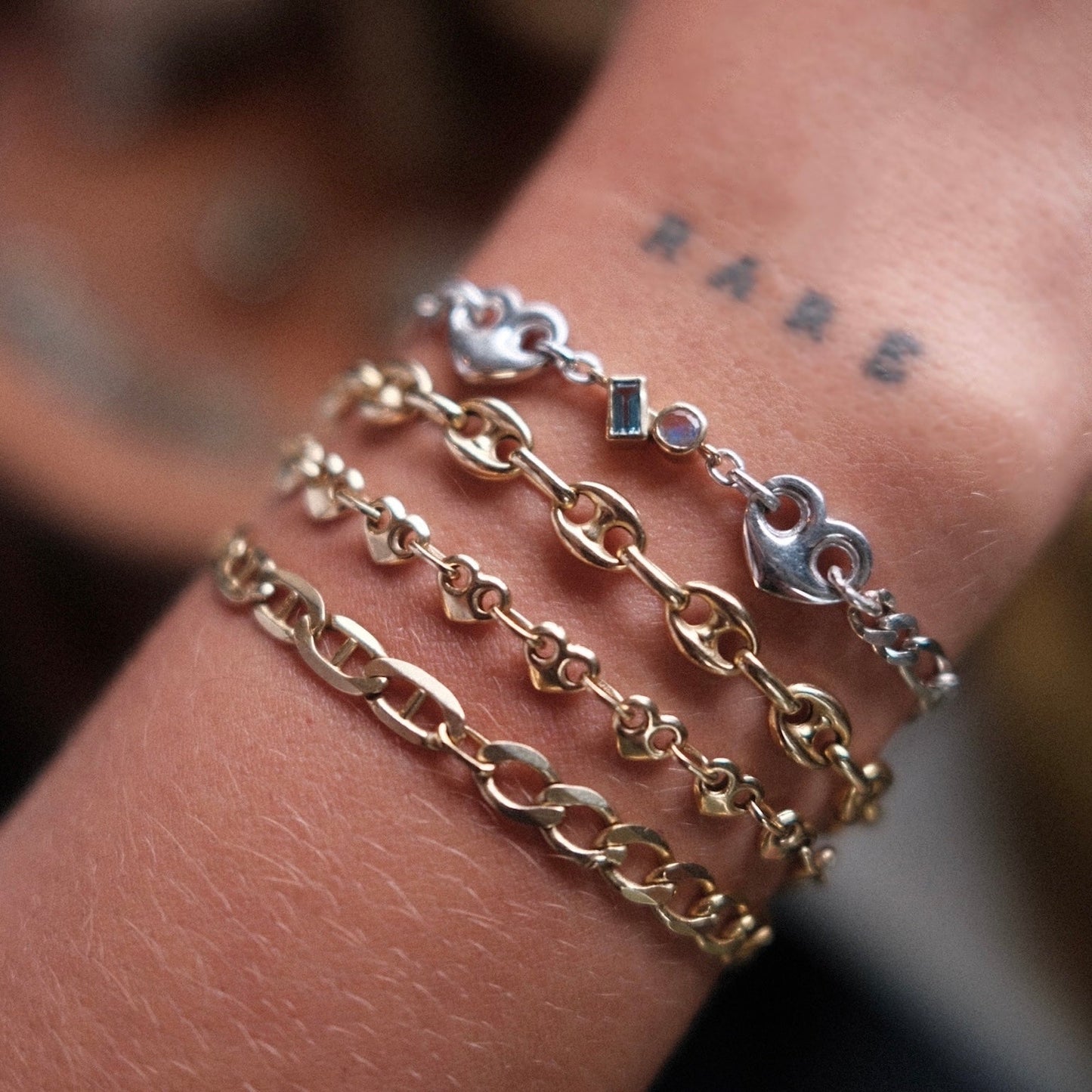 Mixed metal solid yellow gold and sterling silver custom permanent bracelet stack with aquamarine and moonstone toi et moi bezel charm