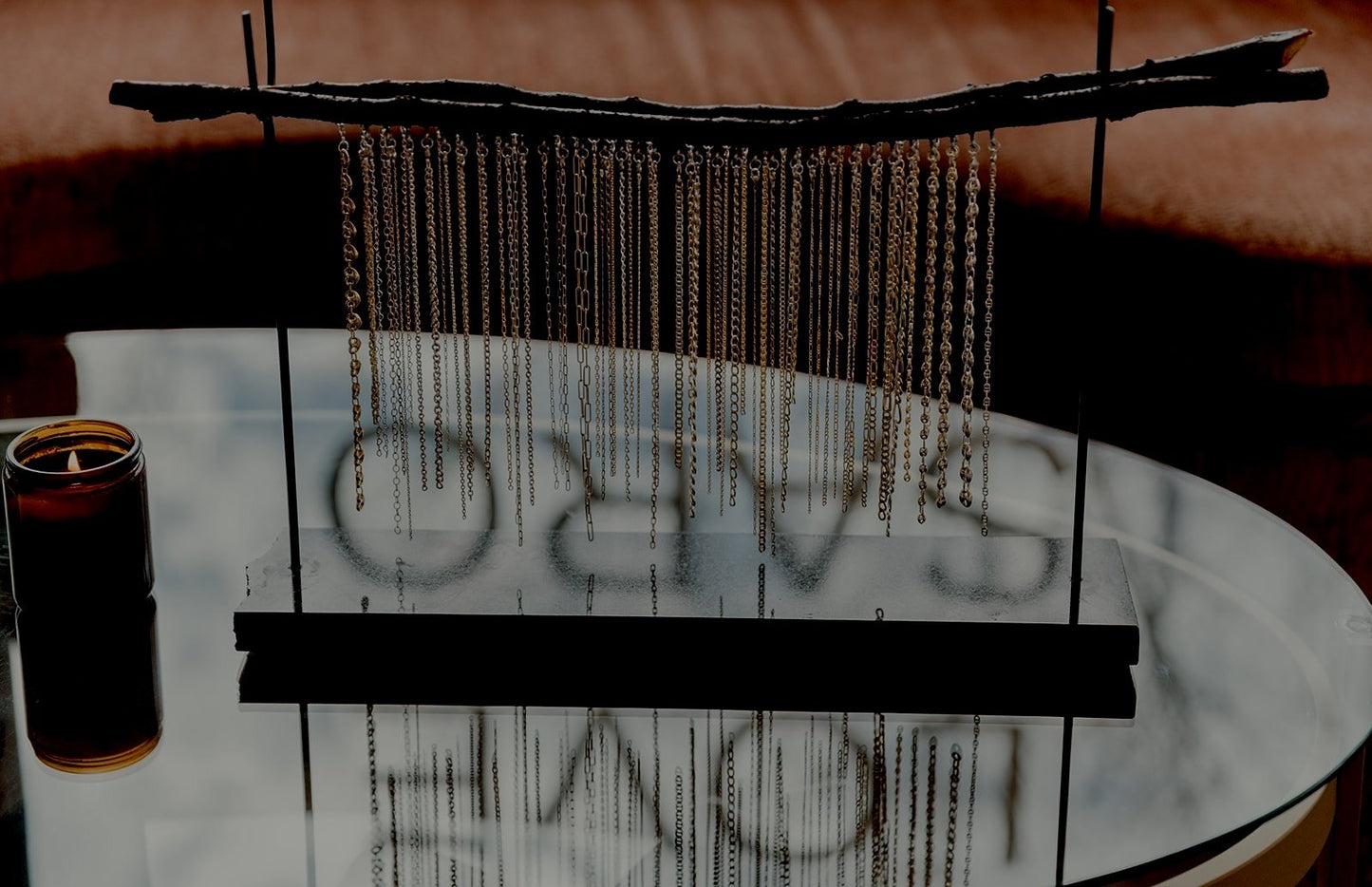 Love Saro permanent jewelry chains hanging in a display